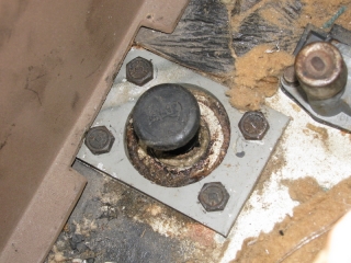 Line lock using original hole, spacer and bolts
