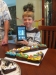 Alex with Kindle and cupcakes